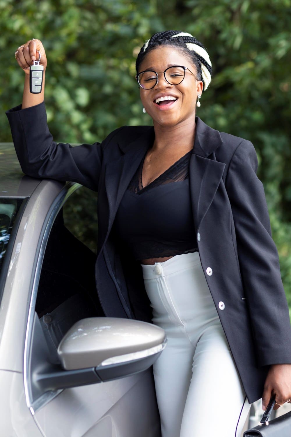 Clutch car sharing  entrepreneur standing in front of Audi with daughter